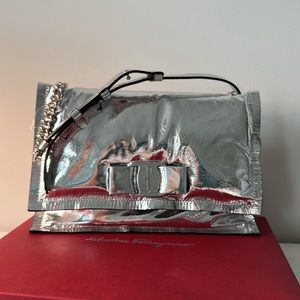 Brand new Silver leather Ferragamo hand bag! In original box and covers. Papers